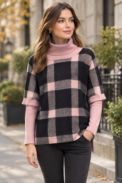 Pink plaid poncho sweater on a female model
