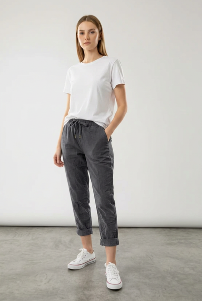 Charcoal drawstring pants on a female model