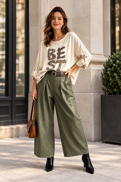 Female model wearing the khaki belted vegan leather gaucho at the same style and length as the first photo