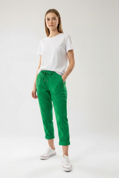 Green drawstring pants on a female model