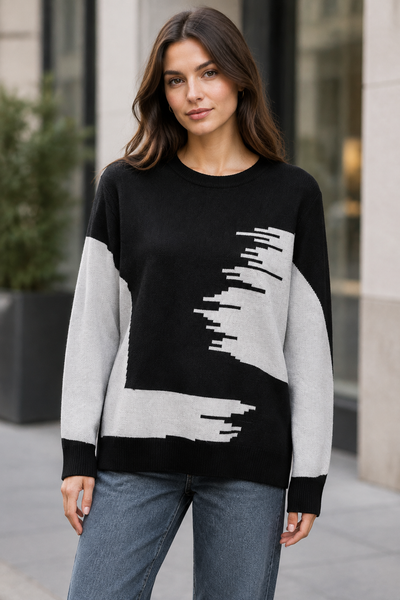 Female model wearing the black long-sleeve two-tone sweater