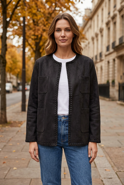 Female model wearing the black Ultra Suede Stitch Trim Jacket with a white top and blue jeans.