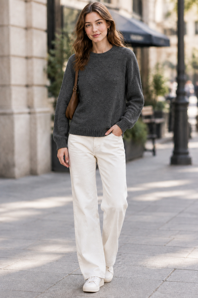 Female model wearing the Detail Front Sweater in charcoal