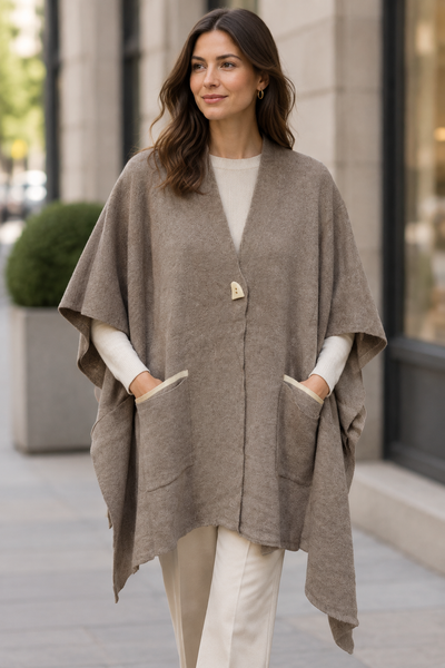 Female model wearing the taupe pocket-front knit poncho from the second gallery photo