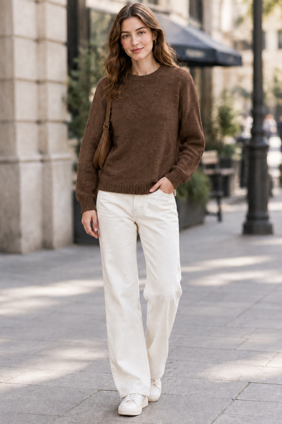 Female model wearing the Detail Front Sweater in brown