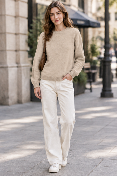 Female model wearing the Detail Front Sweater in beige