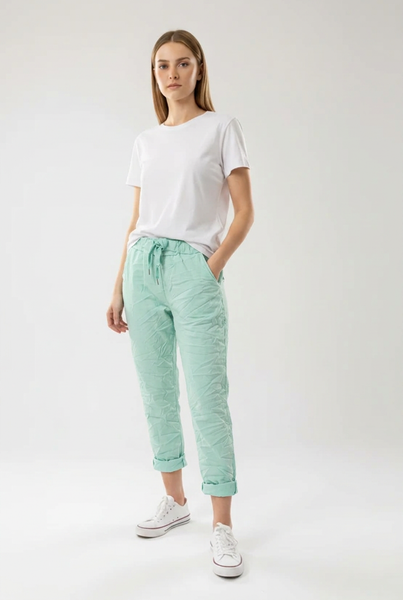 Mint drawstring pants on a female model