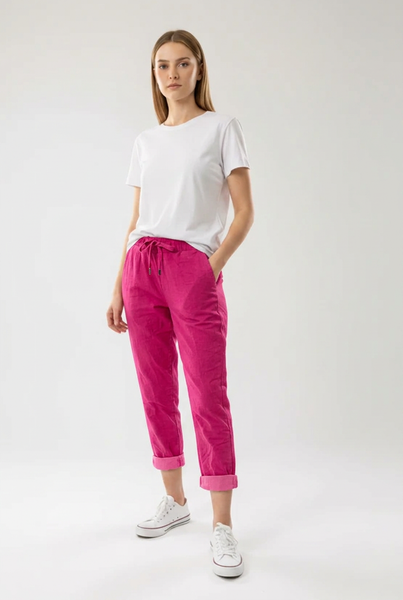Fuchsia drawstring pants on a female model