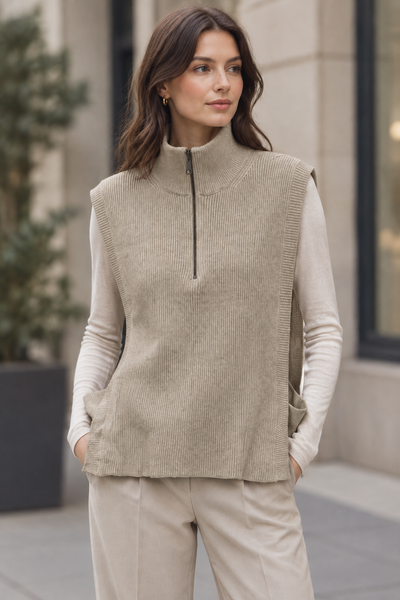 Female model wearing the beige side-open knit vest