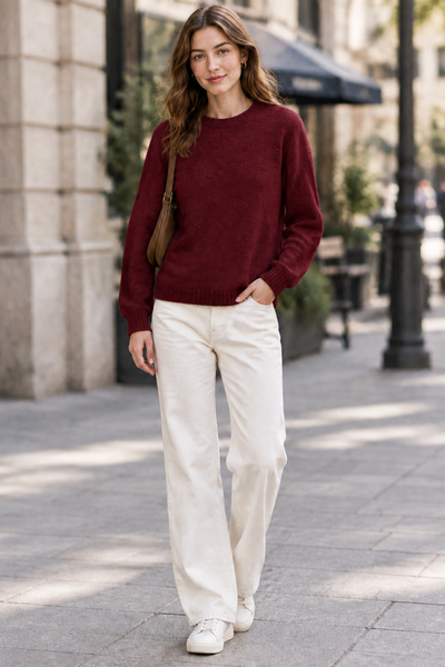 Female model wearing the Detail Front Sweater in burgundy
